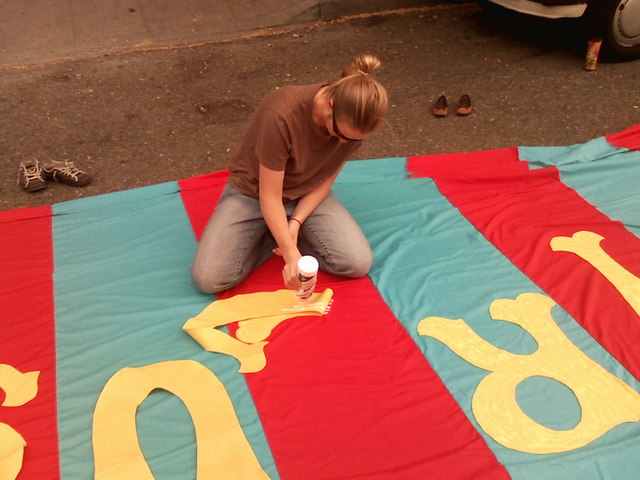 0816081159.jpg: Erica glueing on the letters