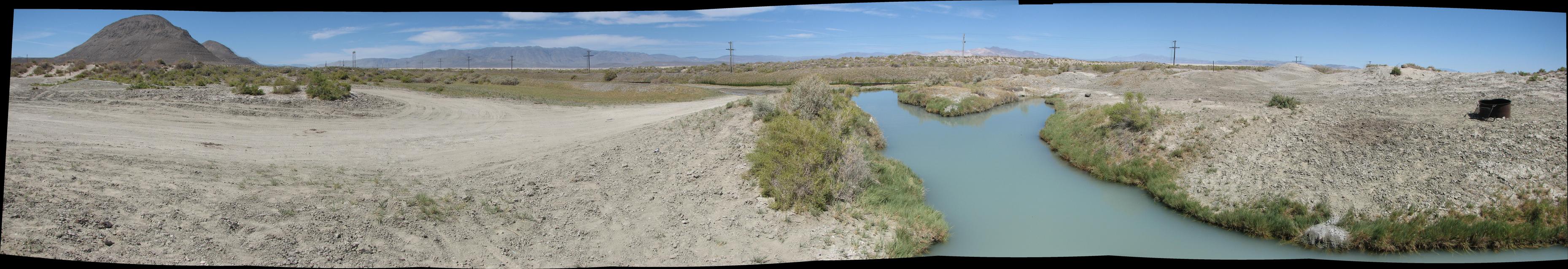 img_8918_pano.jpg: Trego Hot Springs, with the beginnings of BRC in the background